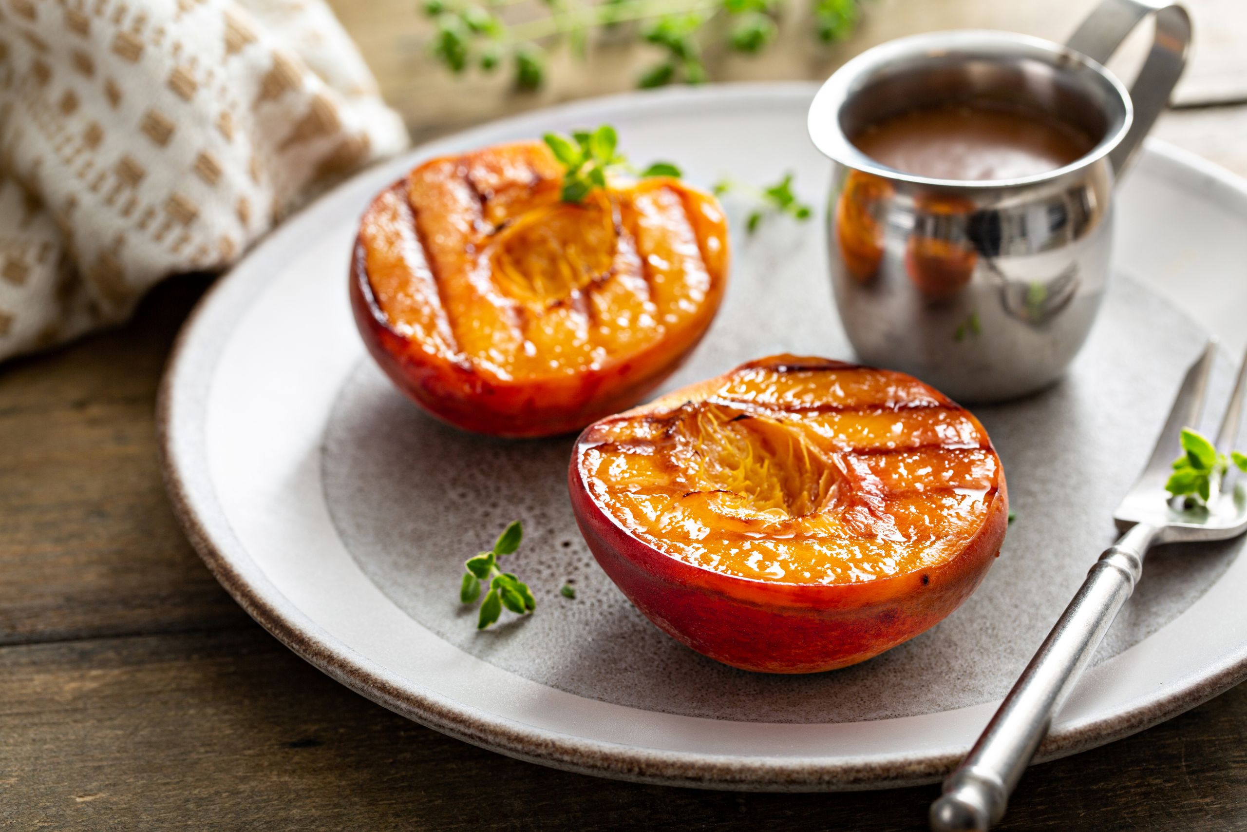 Grilled peaches with caramel sauce, summer dessert
